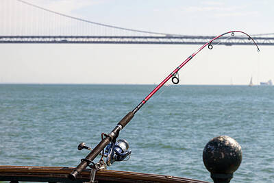 Royalty-Free and Rights-Managed Images - Fishing Rod on the Pier in San Francisco Bay by David Gn