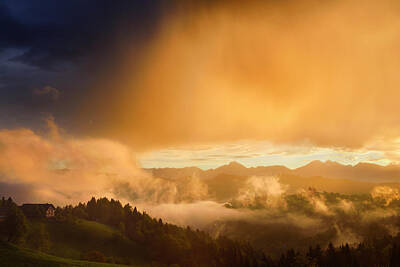 The Who - Golden clouds and fog at sunrise in the mountains of Kamnik Savi by Reimar Gaertner