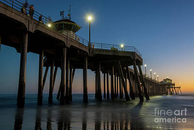 Beach Royalty-Free and Rights-Managed Images - Huntington Beach pier at dusk by Paul Quinn