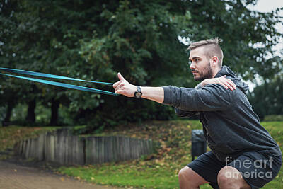 Athletes Photos - Man and his sport routine. City park. by Michal Bednarek