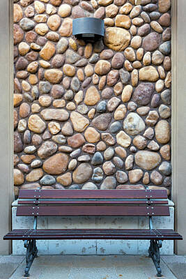 Stocktrek Images - Outdoor Wood Bench by Rock Wall by David Gn