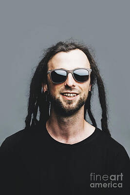 Portraits Royalty-Free and Rights-Managed Images - Portrait of a young smiling man with dreadlocks by Michal Bednarek