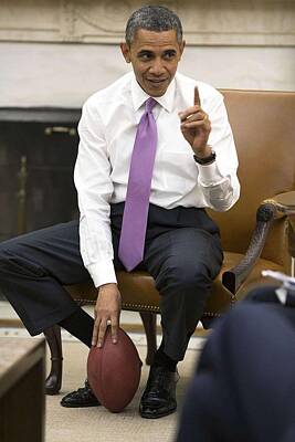 Football Paintings - President Barack Obama holds a football by Celestial Images
