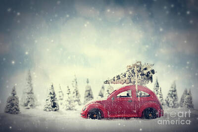 Custom Racing Posters Rights Managed Images - Retro toy car carrying tiny Christmas tree. Fairytale scenery with snow and forest. Royalty-Free Image by Michal Bednarek