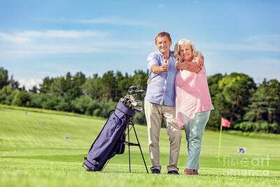 Sports Photos - Senior couple giving thumbs up on a golf course. by Michal Bednarek