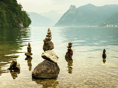 Old Masters - Several stone piles on the shore of lake Traunsee by Stefan Rotter