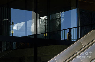 Christmas In The City - Silhouetted man in Business Complex  by Jim Corwin