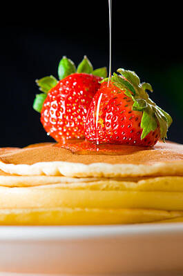 Food And Beverage Royalty-Free and Rights-Managed Images - Strawberry butter pancake with honey maple sirup flowing down by U Schade