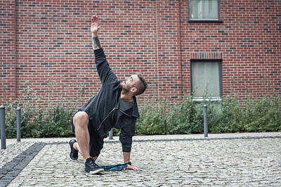 Athletes Photos - Streching in a city enviroment. Outdoor training. by Michal Bednarek
