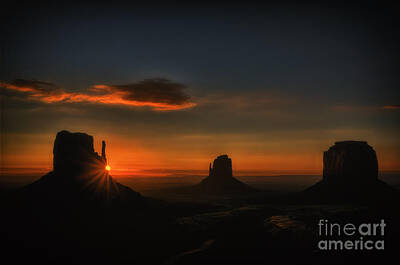 Landmarks Rights Managed Images - Sunrise at Monument Valley Royalty-Free Image by Priscilla Burgers