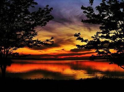 Thomas Moran Royalty Free Images - Sunset Sky Reflecting Off Wilson Lake, Kansas Royalty-Free Image by Greg Rud