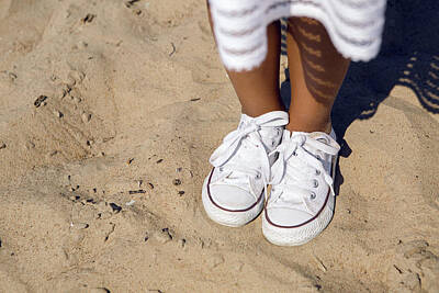 The Delicate Female - Tanned Legs In Sneakers Standing On The Sand by Elena Saulich