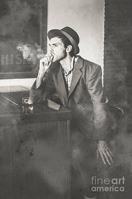 Jazz Royalty-Free and Rights-Managed Images - Vintage man in hat smoking cigarette in jazz club by Jorgo Photography
