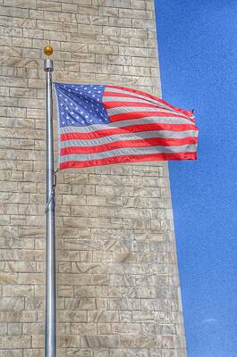Politicians Photo Royalty Free Images - Washington Monument with the American Flag Royalty-Free Image by Marianna Mills