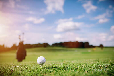 Sports Photos - White golf ball on a green grass by Michal Bednarek