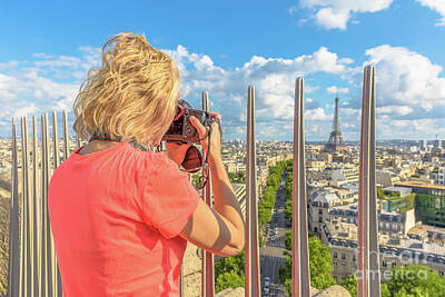 Paris Skyline Photos - Woman photographs Eiffel Tower by Benny Marty