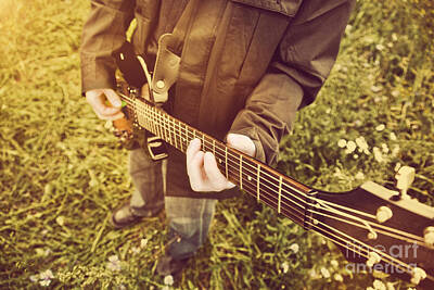 Music Royalty Free Images - Young man playing on the guitar outdoors Royalty-Free Image by Michal Bednarek