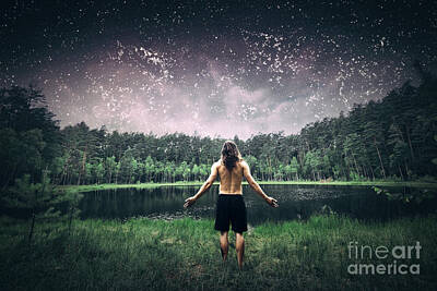 Athletes Photos - Young man standing in the forest at night. by Michal Bednarek
