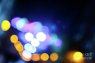 Abstract Skyline Photos - Defocused urban night background with colorful circles. by Joaquin Corbalan