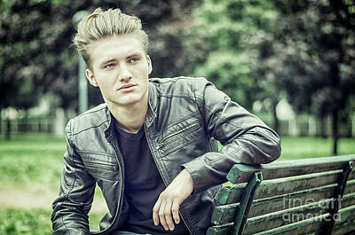 Wild Weather - Handsome blond young man sitting on park bench by Stefano C