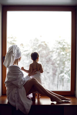 Christmas Typography - Mom And Son Sitting By The Window On A Wide Windowsill by Elena Saulich