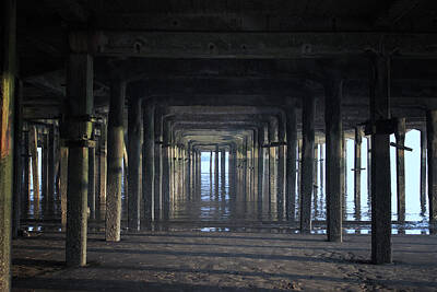 Black And White Rock And Roll Photographs - Under The Pier by Martin Newman