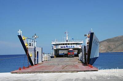 Clouds Royalty Free Images - Agios Antonios cargo ship at Tilos Royalty-Free Image by David Fowler