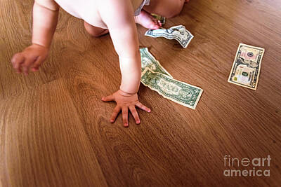 Prescription Medicine - Baby playing with some dollar bills he has found on the floor of by Joaquin Corbalan