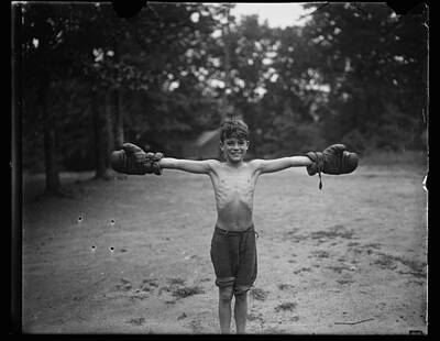 Athletes Royalty-Free and Rights-Managed Images - Boy with boxing gloves c 1926 by Harris and  Ewing by Celestial Images