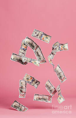 1920s Flapper Girl - Dollar bills falling down on pink background. by Michal Bednarek