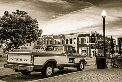 Surrealism Royalty Free Images - Downtown Bentonville Arkansas Square Skyline and Sam Walton Walmart Museum Truck - Sepia Royalty-Free Image by Gregory Ballos