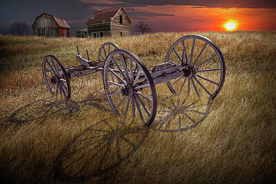 Randall Nyhof Royalty Free Images - Farm Wagon Chassis in a Grassy Field on a Mid West Farm at Sunse Royalty-Free Image by Randall Nyhof