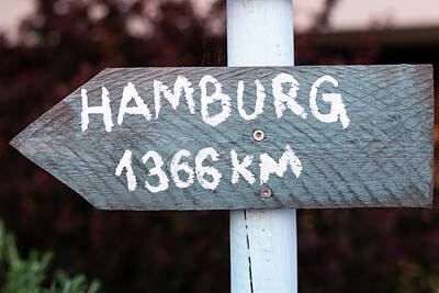 Kitchen Spices And Herbs - grey sign with white font which points to Hamburg by Stefan Rotter