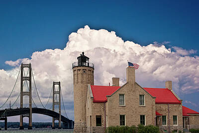 Randall Nyhof Photo Royalty Free Images - Mackinac Bridge and the Mackinaw City Lighthouse at the Straits of Mackinac in Michigan Royalty-Free Image by Randall Nyhof