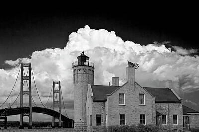 Randall Nyhof Royalty Free Images - Mackinac Bridge and the Mackinaw City Lighthouse in Black and White Royalty-Free Image by Randall Nyhof