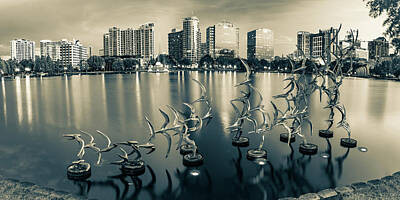 Animals Photos - Orlando Lake Eola Skyline Panorama - Take Flight Bird Sculpture - Sepia by Gregory Ballos