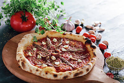 All American - Pizza with anchois and garlic on wooden board. by Michal Bednarek