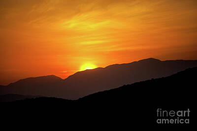 Adventure Photography - Sunrise over the mountains in Nechisar National Park in Ethiopia by John Wollwerth