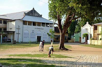 Football Royalty Free Images - Tamil boys play football in compound of St Marys Cathedral Catholic church Jaffna Sri Lanka Royalty-Free Image by Imran Ahmed