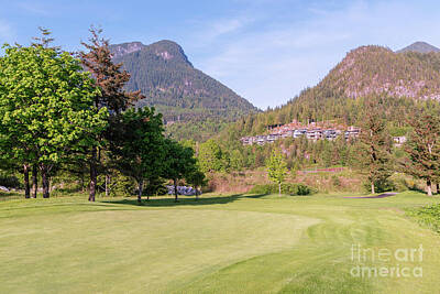 Palm Trees Rights Managed Images - Golf course at the foot of the mountains Royalty-Free Image by Viktor Birkus