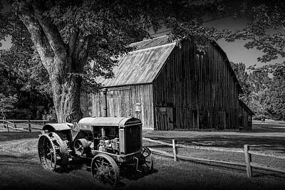 Randall Nyhof Royalty Free Images - Vintage McCormick-Deering Tractor with old weathed Barn and Wood Royalty-Free Image by Randall Nyhof