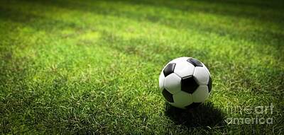 Football Royalty Free Images - Football soccer ball on grass field Royalty-Free Image by Michal Bednarek