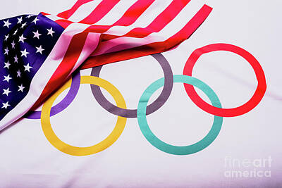 Landmarks Rights Managed Images - Olympic flag folded under the American flag after collecting the materials for the Olympic games aft Royalty-Free Image by Joaquin Corbalan