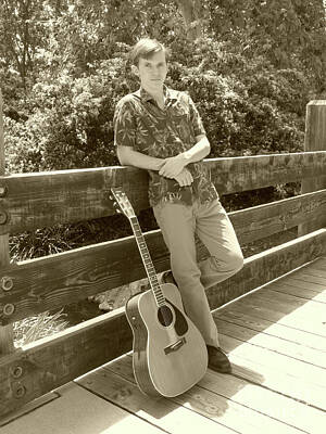 Musicians Photo Rights Managed Images - A Boy and His Guitar Sepia Royalty-Free Image by Connie Sloan