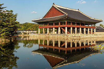 Royalty Free Images - A building of Korean architecture reflecting on a lake at Gyeongbokgung Palace Royalty-Free Image by Snap-T Photography