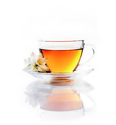 Soap Suds - Asian green tea with jasmine flower in transparent teacup isolat by Jelena Jovanovic