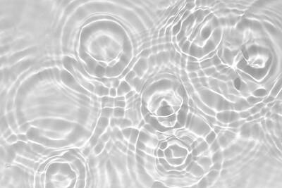 Abstract Drawings - Blurred desaturated transparent clear calm water surface texture with splashes and bubbles. Trendy abstract nature background. White-grey water waves in sunlight.  by Julien