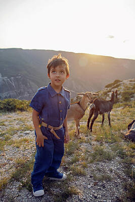 Disney - boy a child of four years 4 walks with goats on a mountain in Dagestan by Elena Saulich