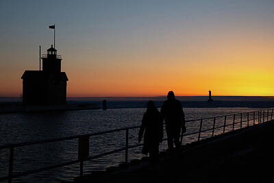 From The Kitchen - Couple walking at sunset on the Holland Michigan Pier  by Eldon McGraw
