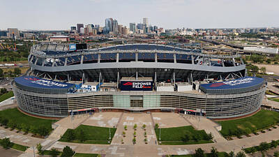 Macaroons Royalty Free Images - Empower Field at Mile High Stadium with Denver Skyline Royalty-Free Image by Eldon McGraw